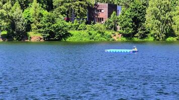 Explore tranquil lakeside scenes with vibrant greenery and calm waters in this serene, idyllic setting photo