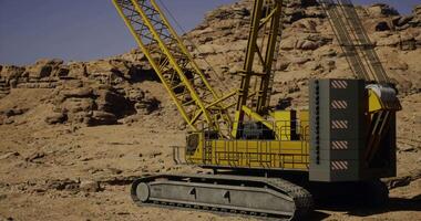 CGI Heavy machinery operates in rugged terrain for construction purposes video