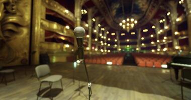 CGI Performance setting with empty chairs and microphone in historic theater video