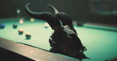 CGI Unique pool table setup featuring a goat skull and scattered billiard balls video