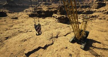 CGI Heavy machinery operates in rugged terrain during daylight hours video