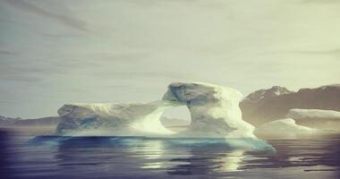 CGI Iceberg with a natural arch floating in calm Arctic waters video