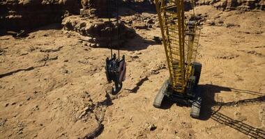 CGI Construction crane operates in rugged terrain during daylight hours video