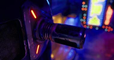 CGI Futuristic close up of a metallic device with neon lights in a vibrant setting video