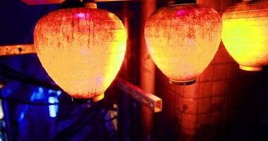 CGI Colorful lanterns illuminating urban night life in vibrant alleyway video