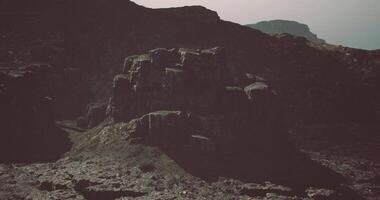 CGI Dramatic rock formations under an overcast sky in a rugged landscape video