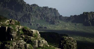 CGI Mountain landscape with rugged rocks and valleys under soft light conditions video