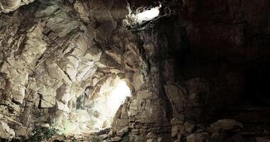 CGI Exploring a dimly lit cave with natural light streaming through openings video