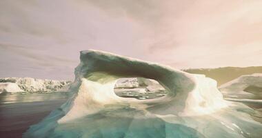 CGI Ice arch formation glowing under sunlight in a serene polar landscape video