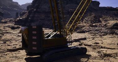 CGI Heavy machinery operates in a rugged landscape during daylight hours video