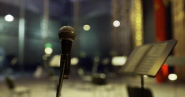 CGI Microphone ready for performance in an empty concert hall at night video