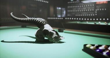 CGI Unique skull centerpiece on a green billiard table in a dimly lit bar video