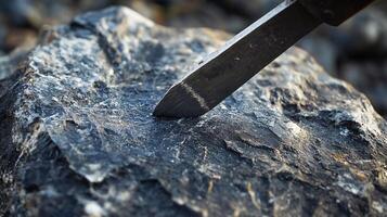 Extreme Close-Up of a Stone Chisel Crafting Intricate Details in Rough Granite photo