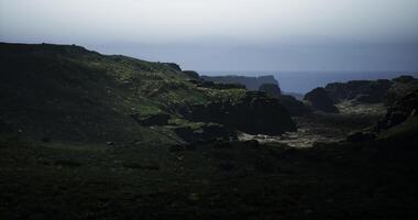CGI Misty landscape with rugged cliffs and green hills overlooking the sea video