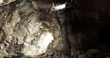 CGI Light streaming through cave opening creates mystical atmosphere in rocky space video