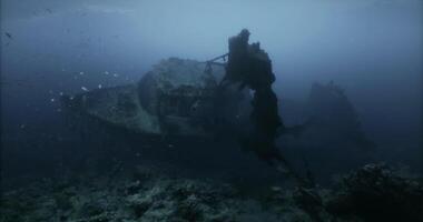 CGI Sunken shipwreck explored in a deep blue ocean during daylight hours video