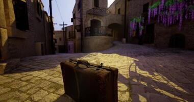 CGI Suitcase resting on cobblestone street in a charming village during daylight video
