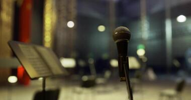 CGI Microphone stands ready for performance in a modern concert hall video