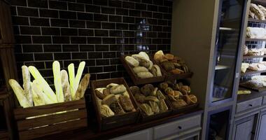 CGI Freshly baked bread displayed in rustic wooden crates inside a bakery video