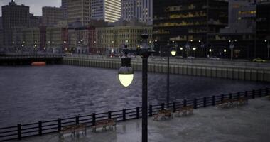 CGI City waterfront at dusk with lamp posts and calm water view video