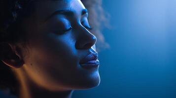 A person with curly hair is immersed in thought while recording a podcast about artificial intelligence. photo