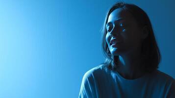 A person with medium-length hair smiles in a softly lit environment, engaged in a thoughtful discussion about artificial intelligence. The ambiance is calming and introspective. photo