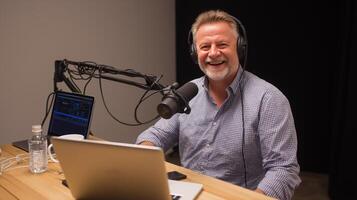A cheerful podcast host sits at a wooden table equipped with a laptop and microphone, discussing artificial intelligence in a cozy recording studio setting. photo