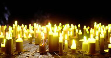 CGI Many candles glowing softly in a dark space create a serene atmosphere video