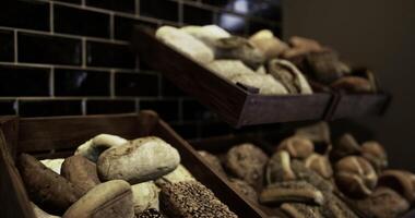 CGI Variety of fresh baked bread displayed in a rustic bakery setting video