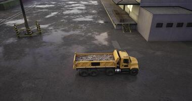 CGI Yellow dump truck unloading debris in an industrial area, overcast video