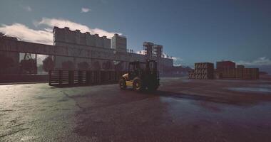 CGI Heavy machinery operates at a large industrial site during daylight hours video
