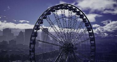 CGI Majestic ferris wheel against a dramatic sky in an urban landscape video