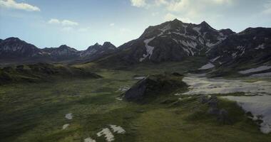 CGI Majestic mountains and green valleys under a bright sky in daytime video
