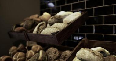 CGI Artisan bread displayed on wooden racks in a cozy bakery environment video