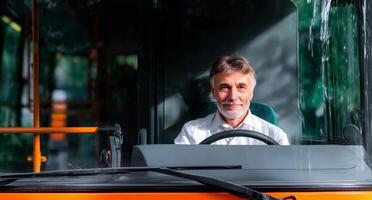 A man sits confidently at the wheel of a truck, displaying a cheerful demeanor. Sunlight streams through the windshield, enhancing the casual ambiance of the moment. photo