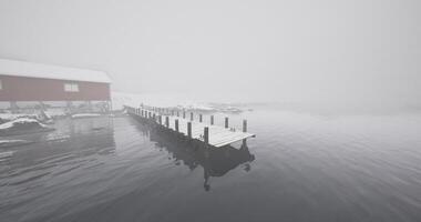 CGI Misty winter morning at a dock on a quiet lake surrounded by snow video