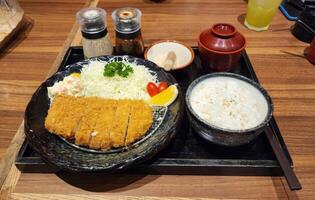 Delicious Japanese Cuisine with Crispy Pork Cutlet and Rice photo