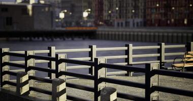 CGI Urban waterfront park with railings and bench during late afternoon light video