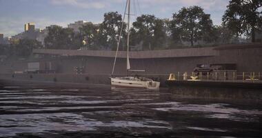 CGI Sailboat docks at a serene waterfront on a cloudy afternoon video