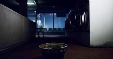 CGI Mysterious moment in a dimly lit laundromat with an abandoned bucket video