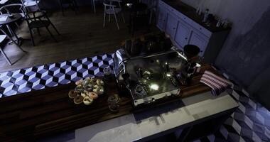 CGI Brightly lit cafe counter featuring espresso machine and pastries on display video