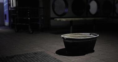 CGI Dark corner with an empty basin at a laundromat during nighttime video
