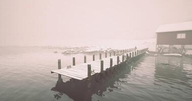 CGI Foggy winter morning on a secluded dock with snow covered surroundings video