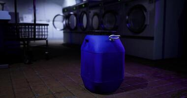 CGI Large blue container placed in a dimly lit laundromat during nighttime video