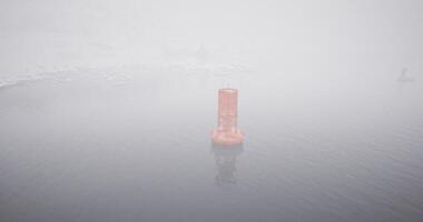 CGI Foggy day with a solitary buoy standing in calm waters video