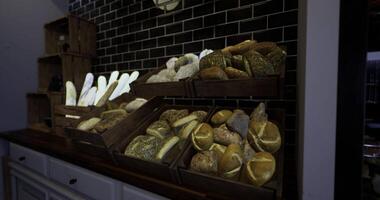CGI Freshly baked artisanal bread displayed in wooden crates in a bakery video