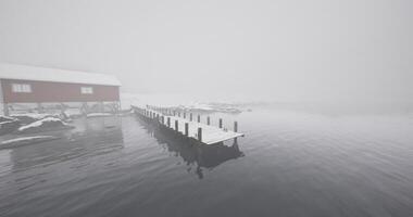 CGI Tranquil winter landscape with dock and cabin in foggy weather video