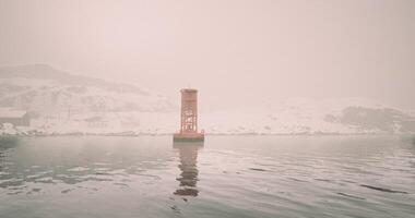 CGI Buoy standing in calm waters surrounded by fog and snow covered landscape video