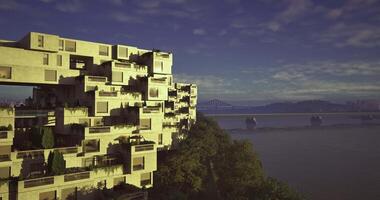 CGI Modern architecture along the riverside with green spaces and city view video