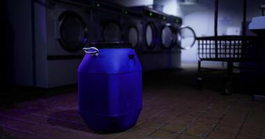 CGI Laundry facility with a blue container in a low lit environment video